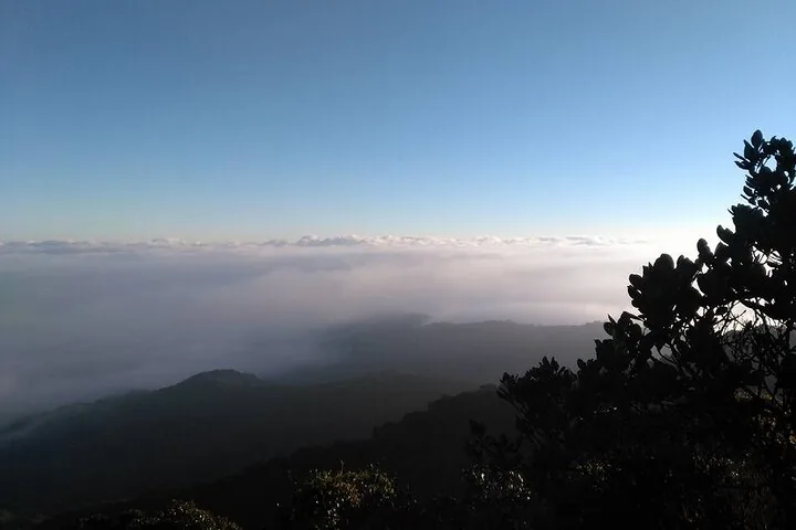 Above the clouds view from a mountain peak at sunrise